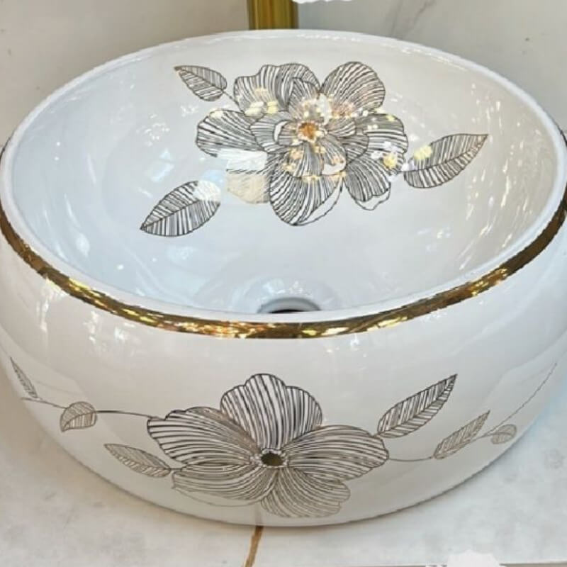 Lavamanos con flores doradas