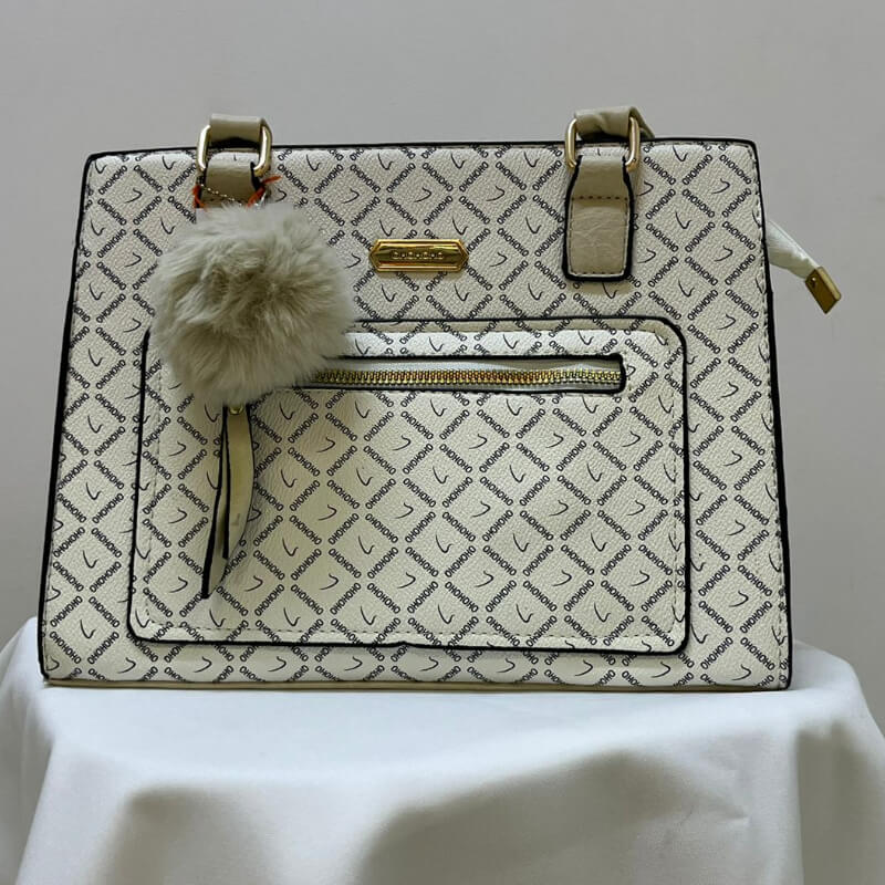 Bolsa blanca con pompón blanco